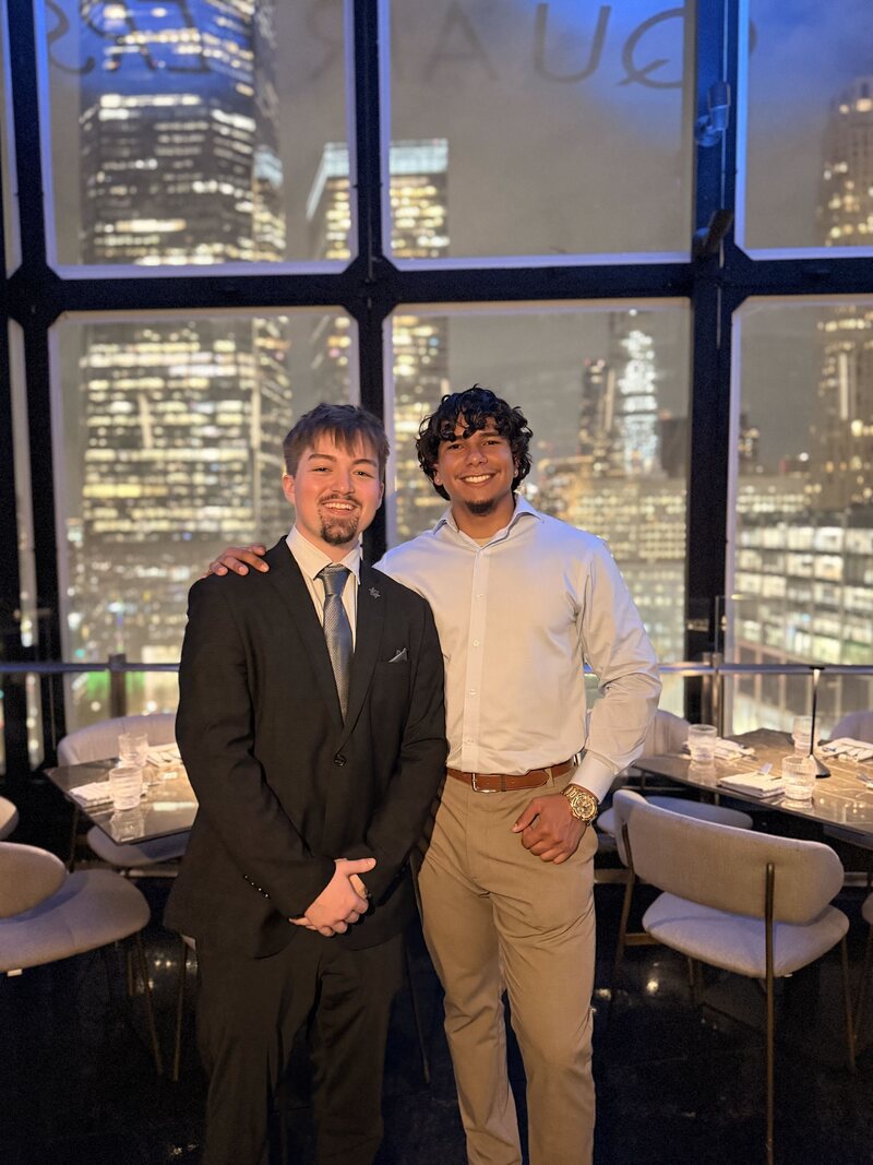 Two Frostline Foundations professionals at an evening networking event